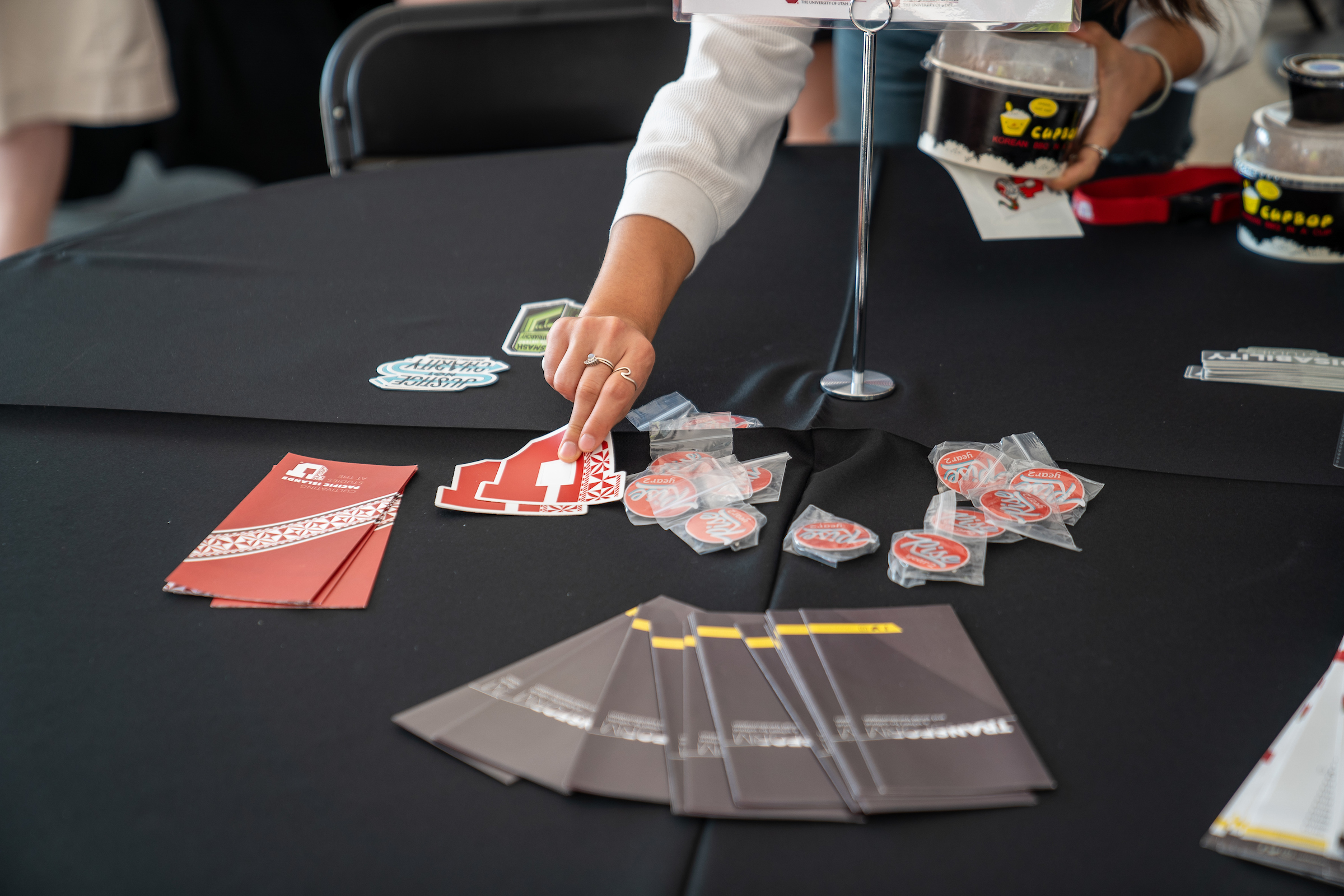 tabletop with Transform's stickers and brochures