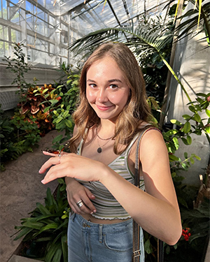 Talea Steele poses with a butterfly on her hand