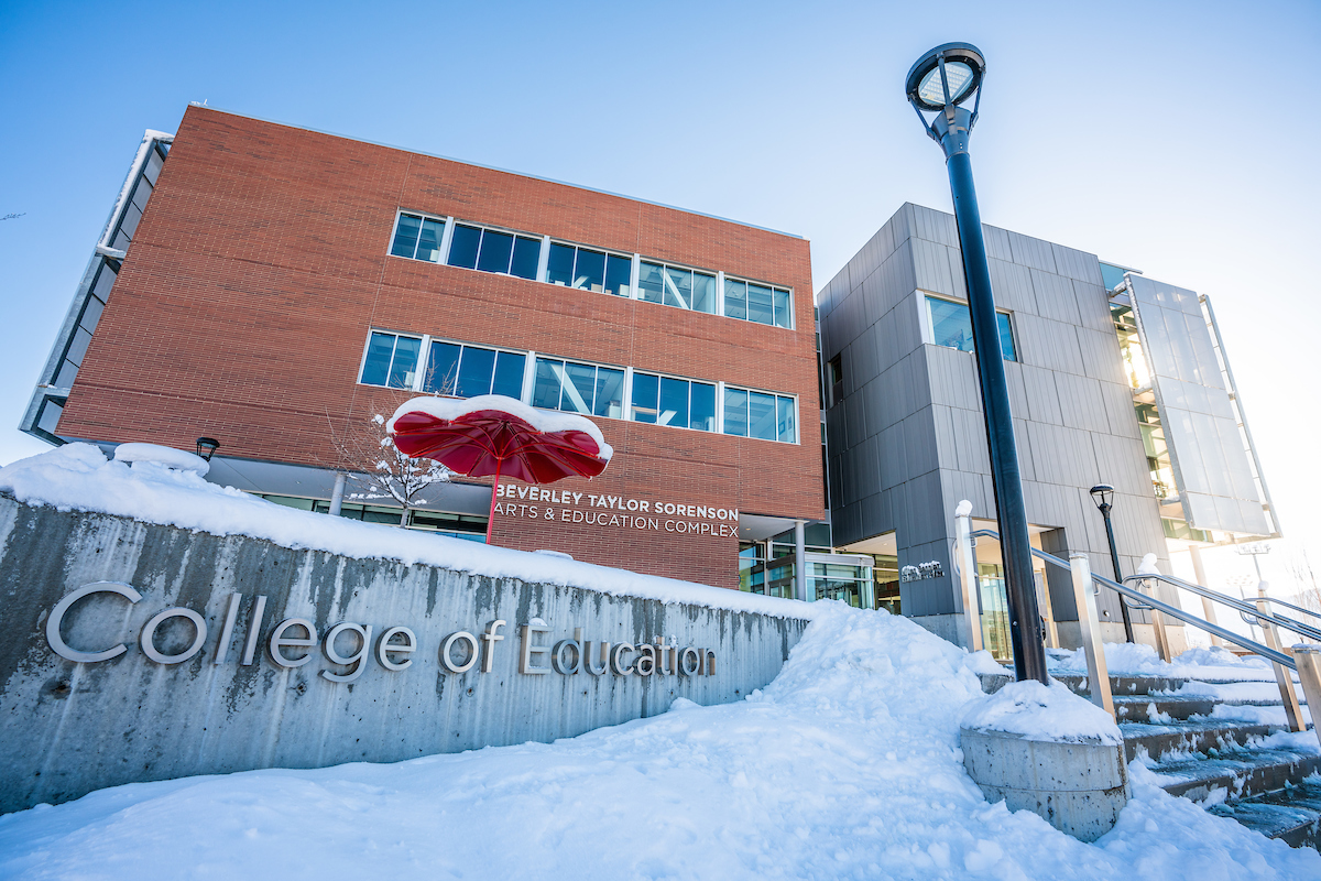 the exterior of the College of Education building covered in snow